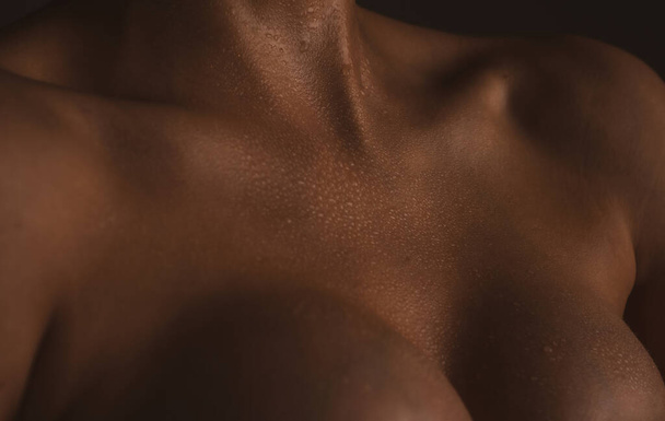 Augmentation breast surgery. Closeup naked girl chest. - Fotó, kép