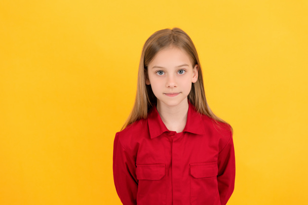 teen child with cute face on yellow background - Photo, Image