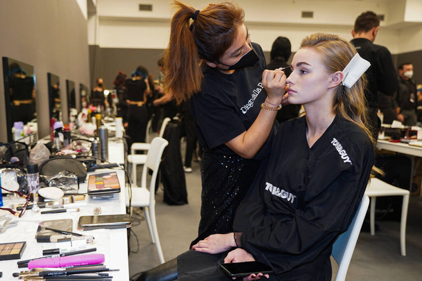 MILAN, ITALY - FEBRUARY 25: A model getting ready backstage before the Elisabetta Franchi fashion show during the Milan Fashion Week Fall/Winter 2022/2023 on February 25, 2022 in Milan, Italy. - 写真・画像