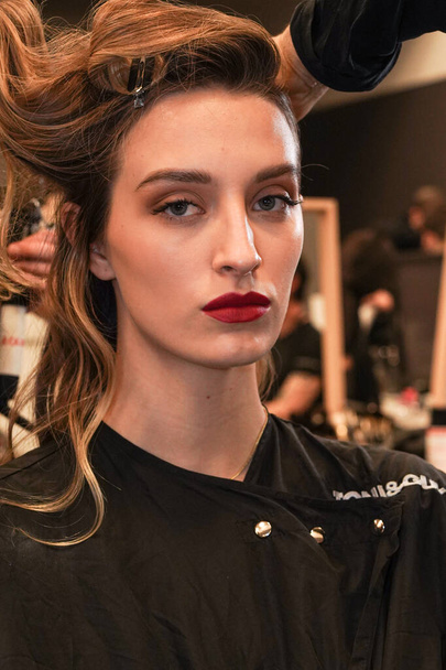 MILAN, ITALY - FEBRUARY 25: A model getting ready backstage before  the Elisabetta Franchi fashion show during the Milan Fashion Week Fall/Winter 2022/2023 on February 25, 2022 in Milan, Italy. - 写真・画像