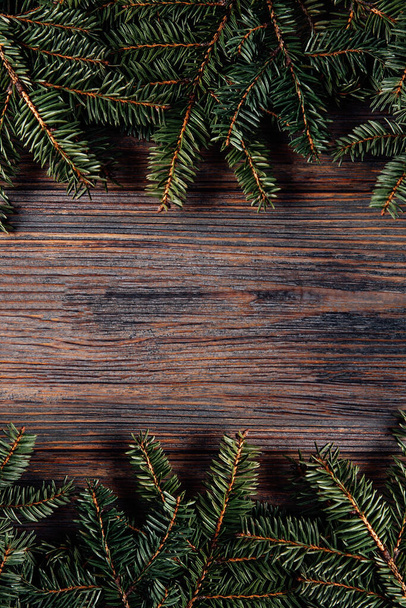 Christmas wooden rustic background with fir tree. - Zdjęcie, obraz