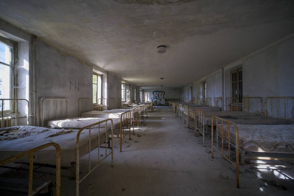 orphanage dormitory in large abandoned house. High quality photo - Foto, imagen