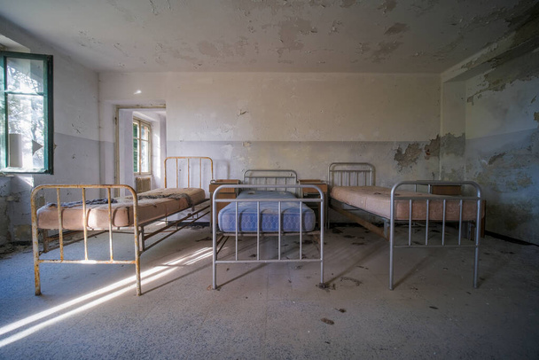 orphanage dormitory in large abandoned house. High quality photo - Fotó, kép