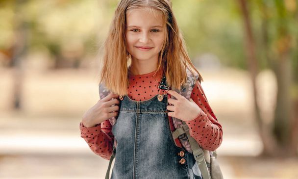 Preteen school girl with backpack - Fotó, kép