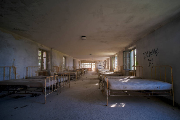 orphanage dormitory in large abandoned house. High quality photo - Фото, изображение
