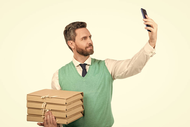 handsome man manager hold heap of folder with documents making selfie on smartphone, selfie. - Foto, Imagem