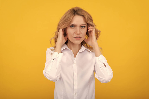 Unhappy ill woman touch ears suffering from ear pain yellow background, earache - Φωτογραφία, εικόνα