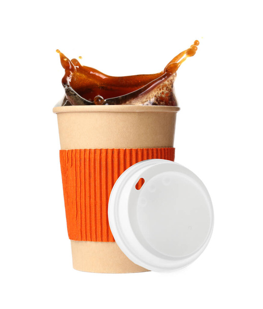 Takeaway paper cup with splashing coffee and plastic lid on white background - Foto, afbeelding