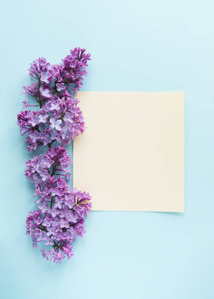 Beautiful flower arrangement. Lilac flowers, free space for text on a light pastel background. Wedding, birthday. Valentine's day, mother's day. Top view, copy space - 写真・画像