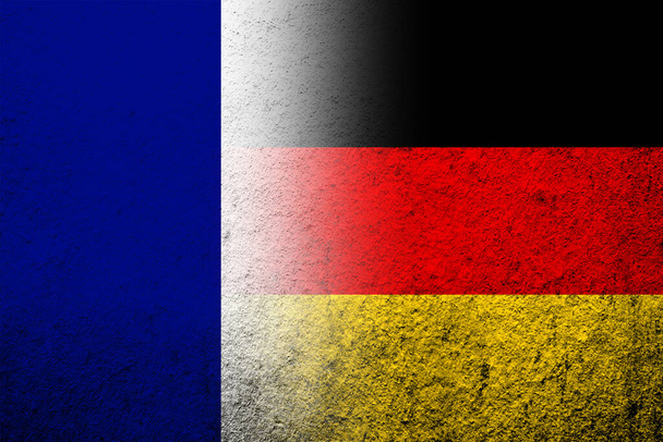 The national flag of Germany with The national flag of France. Grunge background - Foto, Bild