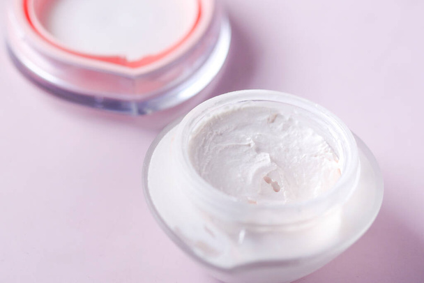 Close up of beauty cream in a pink container  - Foto, imagen