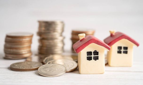 House on stack coins, mortgage home loan finance concept. - Φωτογραφία, εικόνα