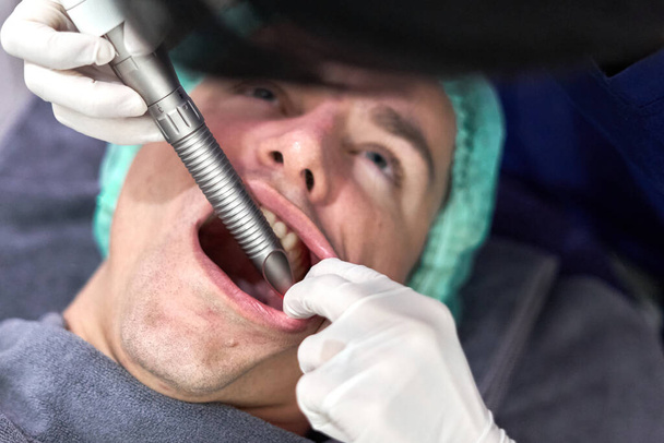 Close up view of the face of a patient getting a facial rejuvenation treatment - Foto, afbeelding