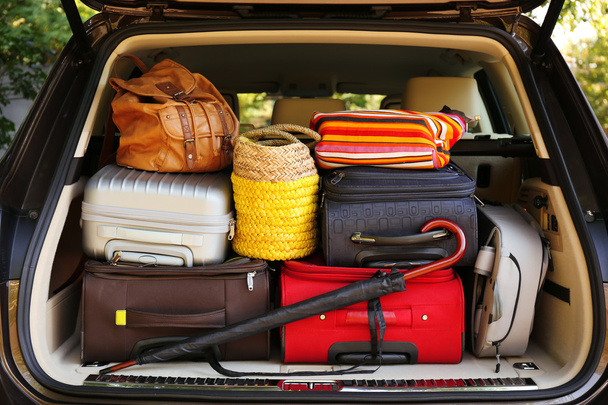 Suitcases and bags in trunk of car - Photo, image