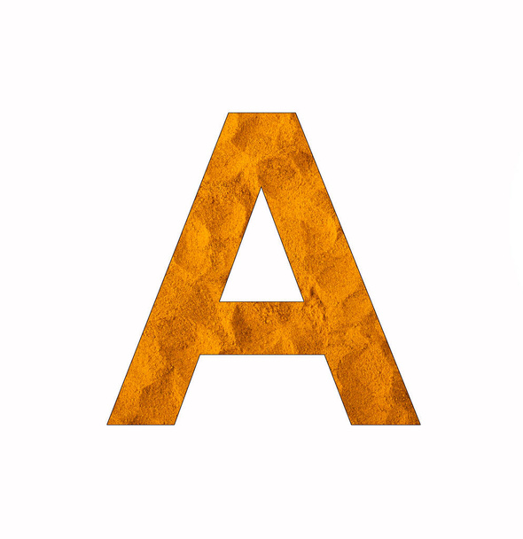 Letter A on turmeric background - Uppercase alphabet - Photo, Image