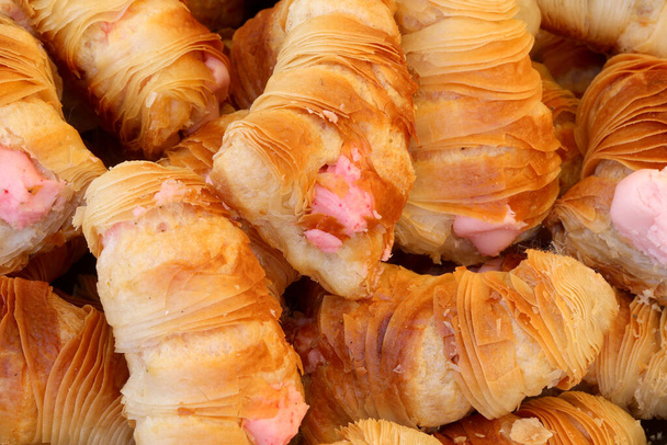 typical Italian food called cannolo or cannoncini is a very tasty pastry for sale in shops - Photo, Image