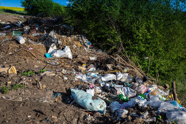 Garbage dump in the open air outside the city. - Photo, Image