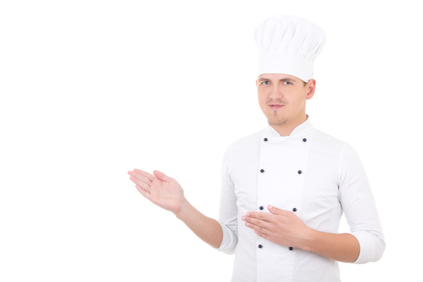 молодий чоловік шеф-кухар показує або представляє щось ізольоване над
 - Фото, зображення