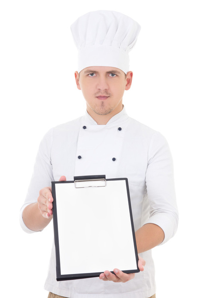 young handsome man in chef uniform showing clipboard with blank  - Photo, image