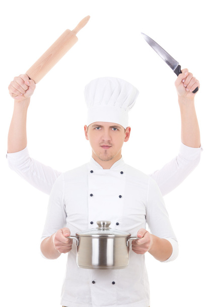 Concept de cuisine-jeune homme en uniforme à quatre mains holding isolé sur fond blanc des équipements de cuisine de chef - Photo, image
