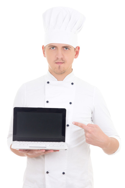 young man in chef uniform holding laptop with empty screen isola - Photo, Image