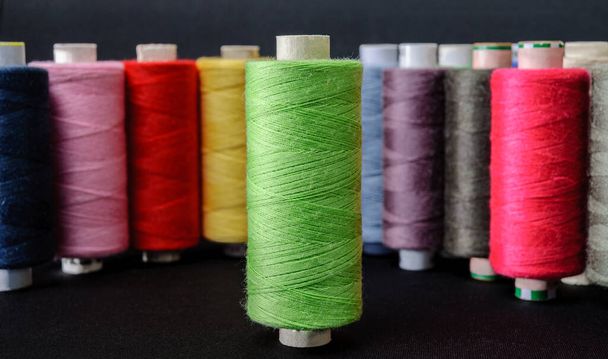 colorful sewing threads on a white background - Фото, изображение