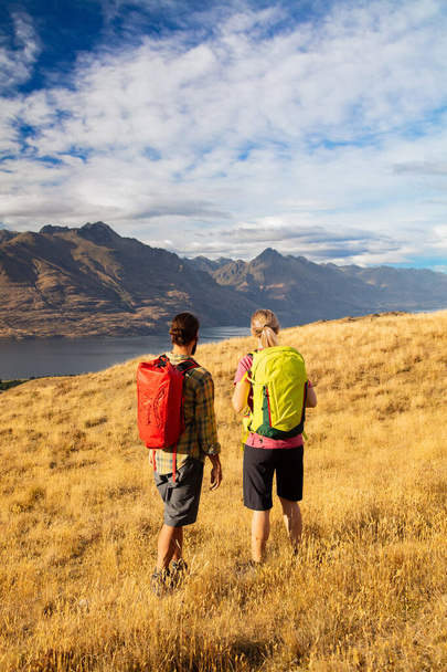 Healthy young Caucasian travel adventure couple on hiking trip in New Zealands Fjordland The Remarkables National Park South Island - Photo, Image