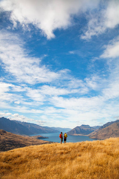 Healthy young Caucasian travel adventure couple on hiking trip in New Zealands Fjordland The Remarkables National Park South Island - Photo, Image