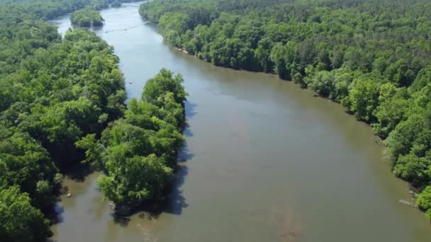 Aerial push over muddy waters of the Catawba River in South Carolina, USA - Кадри, відео