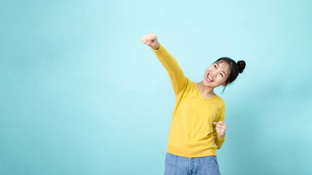 Young woman celebrate victory - 写真・画像