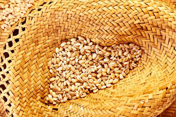 Heap of uncooked pearl barley on hat , cereal grains - Foto, Bild