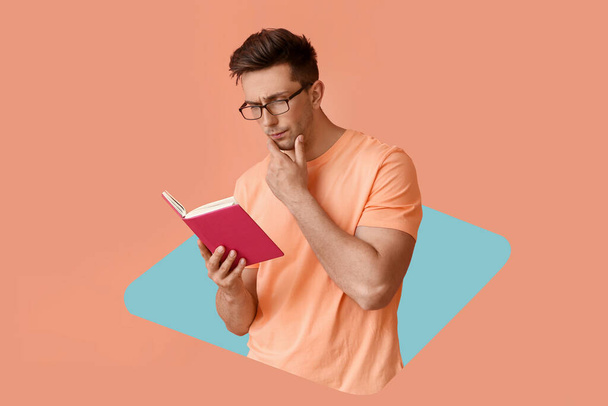 Portrait of handsome thoughtful young man with book on pink background - Foto, Imagen