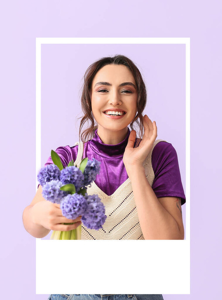 Pretty young woman with hyacinth flowers looking out of frame on lilac background - Fotografie, Obrázek