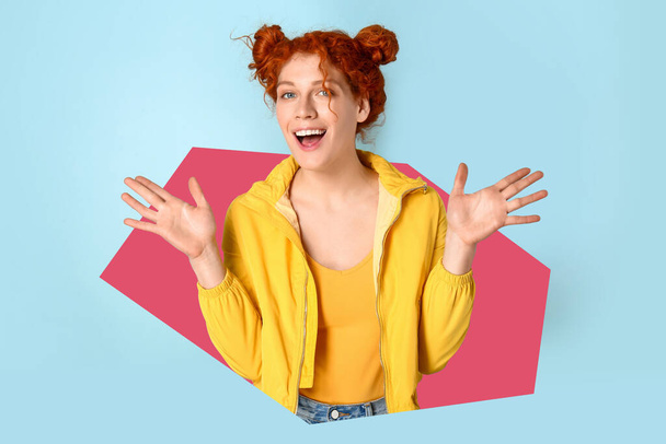 Happy smiling redhead woman on light blue background - Photo, image