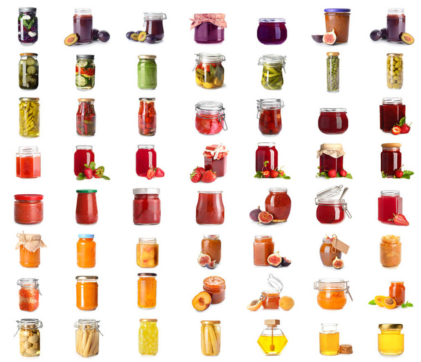 Set of jars with different preserved food on white background - Foto, imagen