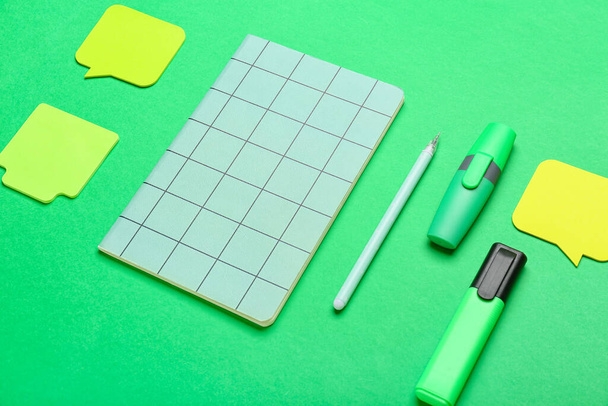 Blank sticky notes, notebook, pen and markers on color background - Photo, Image
