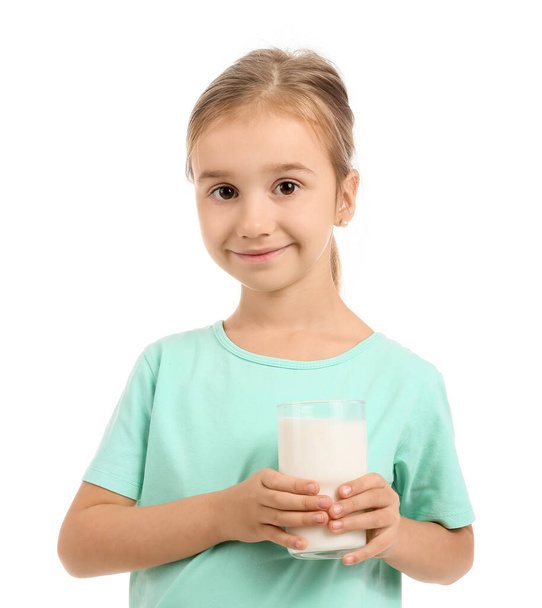 Portrait of little girl with glass of milk on white background - Foto, afbeelding
