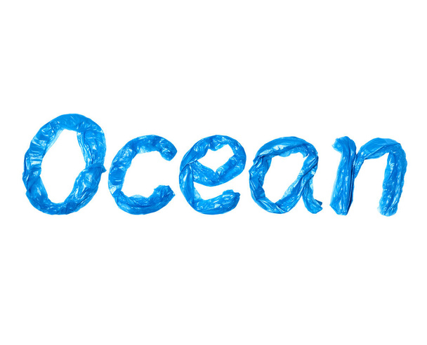 The inscription Ocean created by blue garbage bags, isolated on a white background - Photo, image