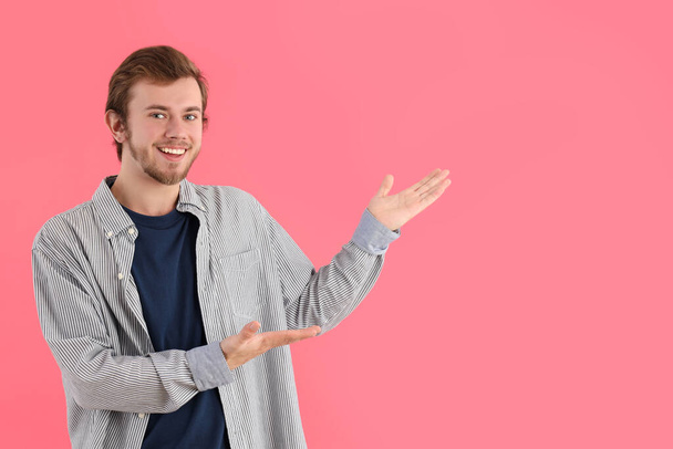 Concept of people, young man on pink background - Photo, Image