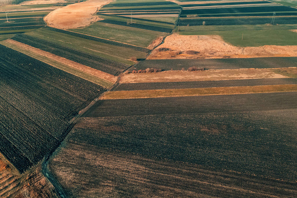 Aerial view of plowed agricultural fields in december, high angle view drone photography - Φωτογραφία, εικόνα