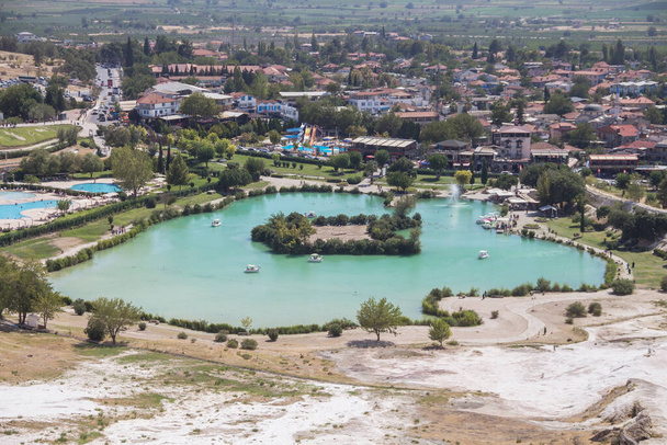 Turkey, Denizli, 29.08.2021: Blue lake near the travertines of Pamukkale in Turkey. Travel in Turkey. - Photo, Image