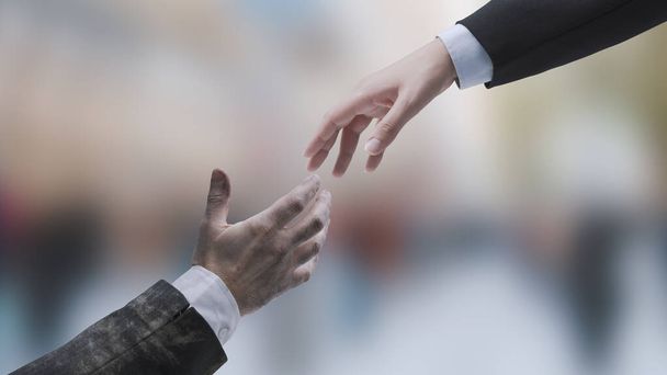 Businessman giving a handshake to a failed jobless business executive: get help and support for your business - Photo, Image