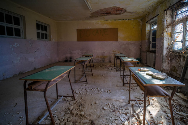 School desks for students in orphanage in old abandoned mansion. High quality photo - Photo, Image