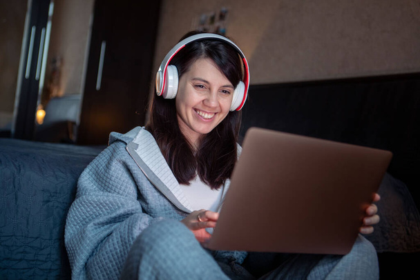 woman in headset working on laptop has video call remote job from home - Zdjęcie, obraz