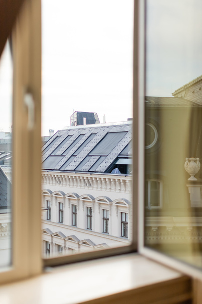 view from blurred window on rooftop of urban building - Zdjęcie, obraz