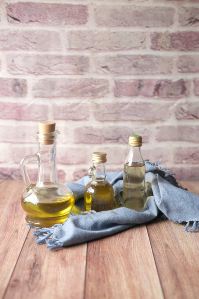  different bottle of olive oil on table  - Foto, Imagen
