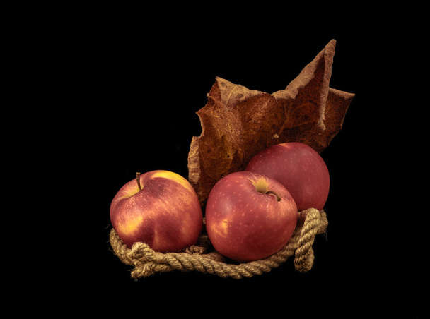 Red apples on a black background. - Foto, afbeelding