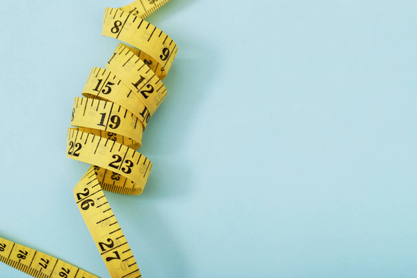 tape measure for obese people on a blue background - Photo, Image