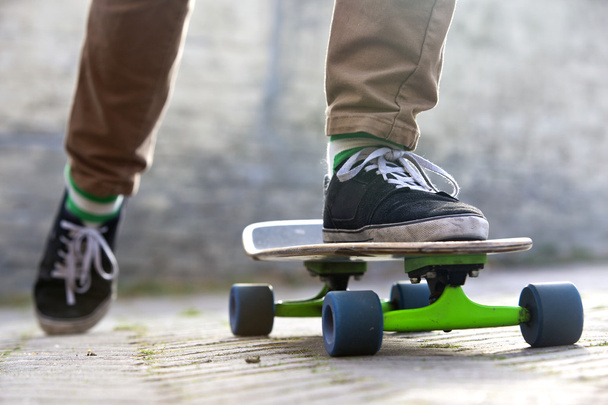 Male feet setting on his skateboard - Φωτογραφία, εικόνα