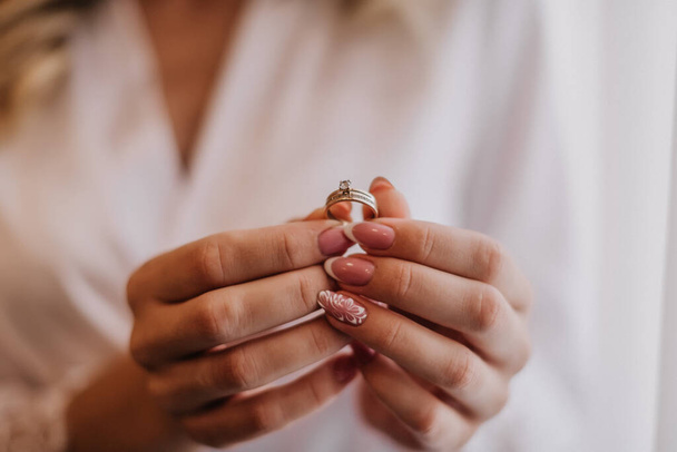 Wedding ring in brise's hands - Photo, image